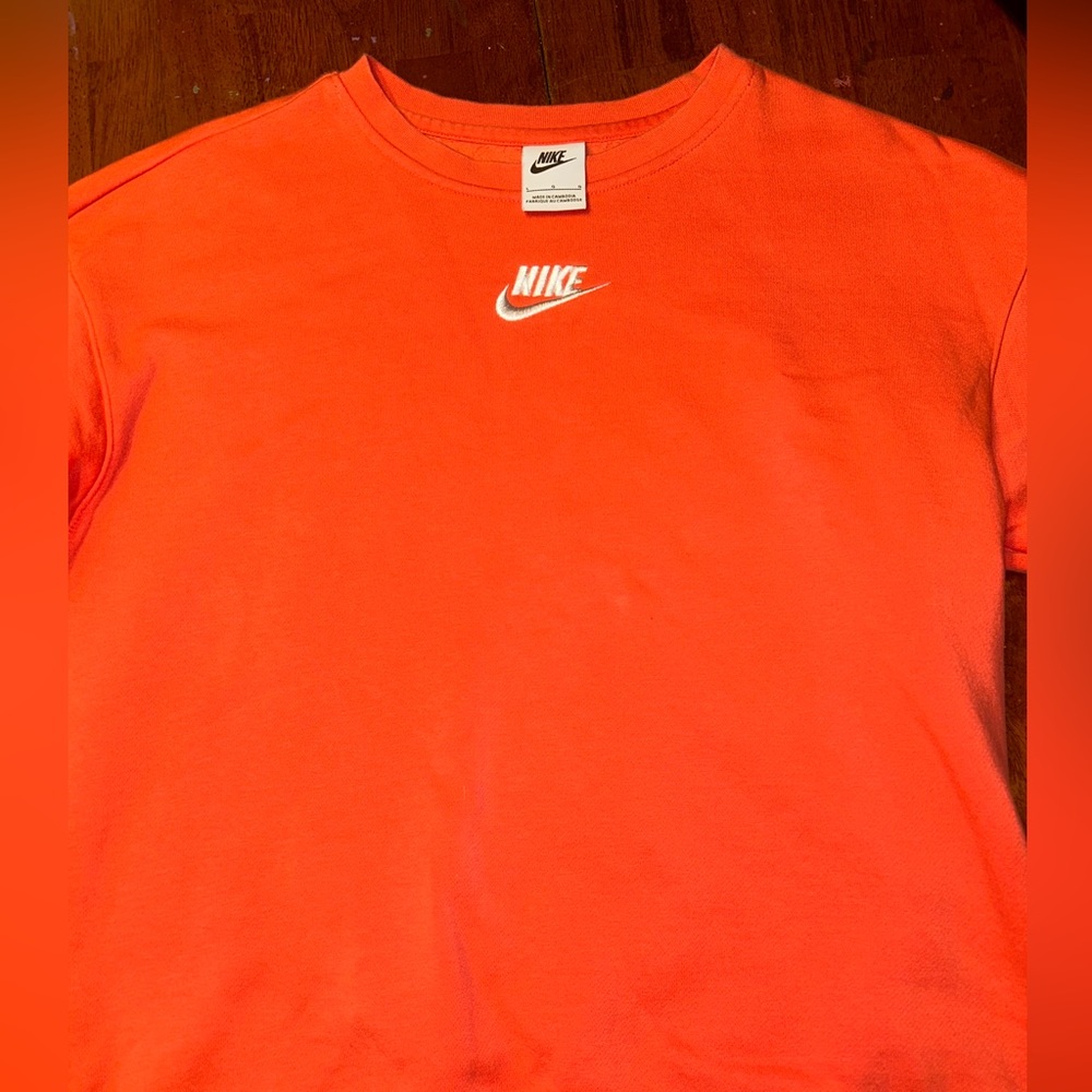 Pink nike crewneck, looks more pink in real life. Runs super small. Long sleeve.
